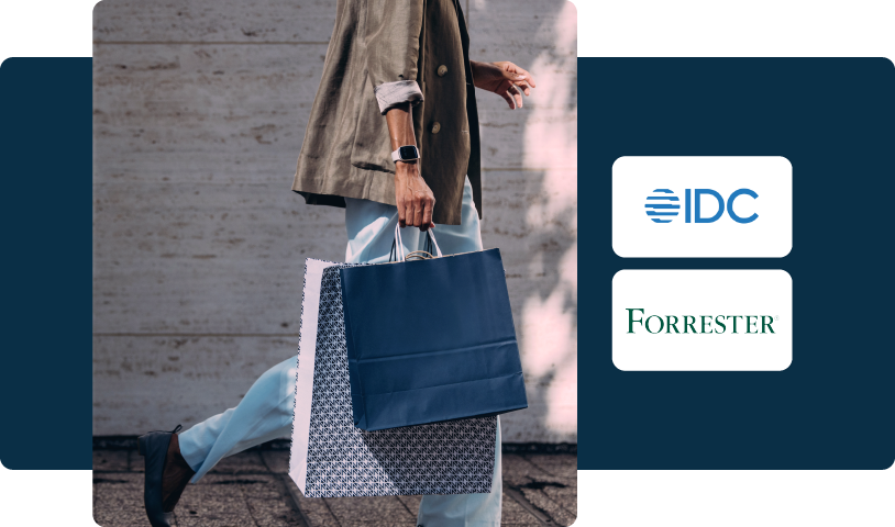 Image of a person walking carrying shopping bags next to IDC and Forrester Logos