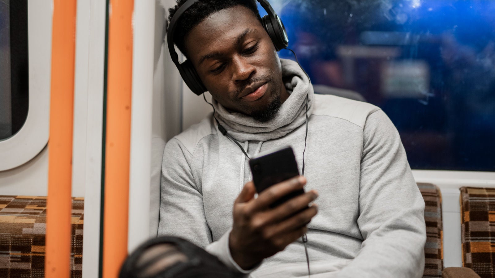 Person enjoying music using headphones 