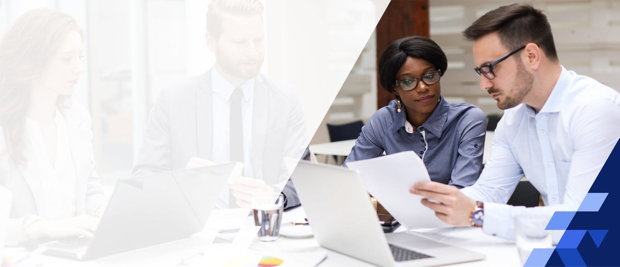 Coworkers reviewing paperwork together at a desk