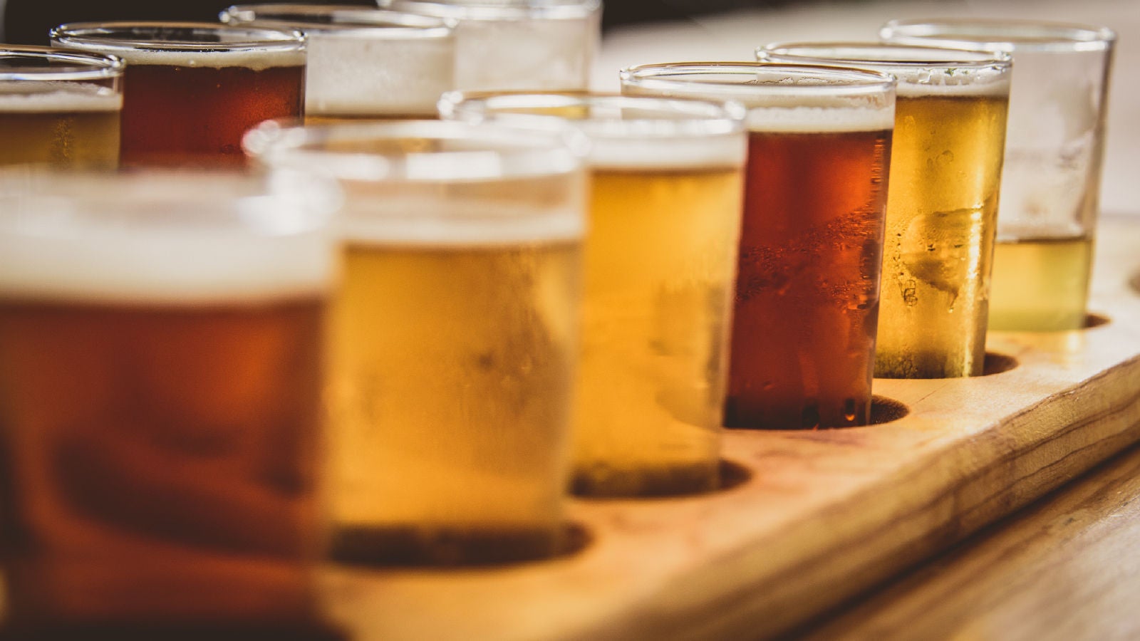Close up of several glasses full of alcoholic beverages