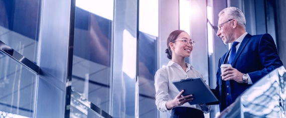 Businessman and Businesswoman exchanging words on a coffee break