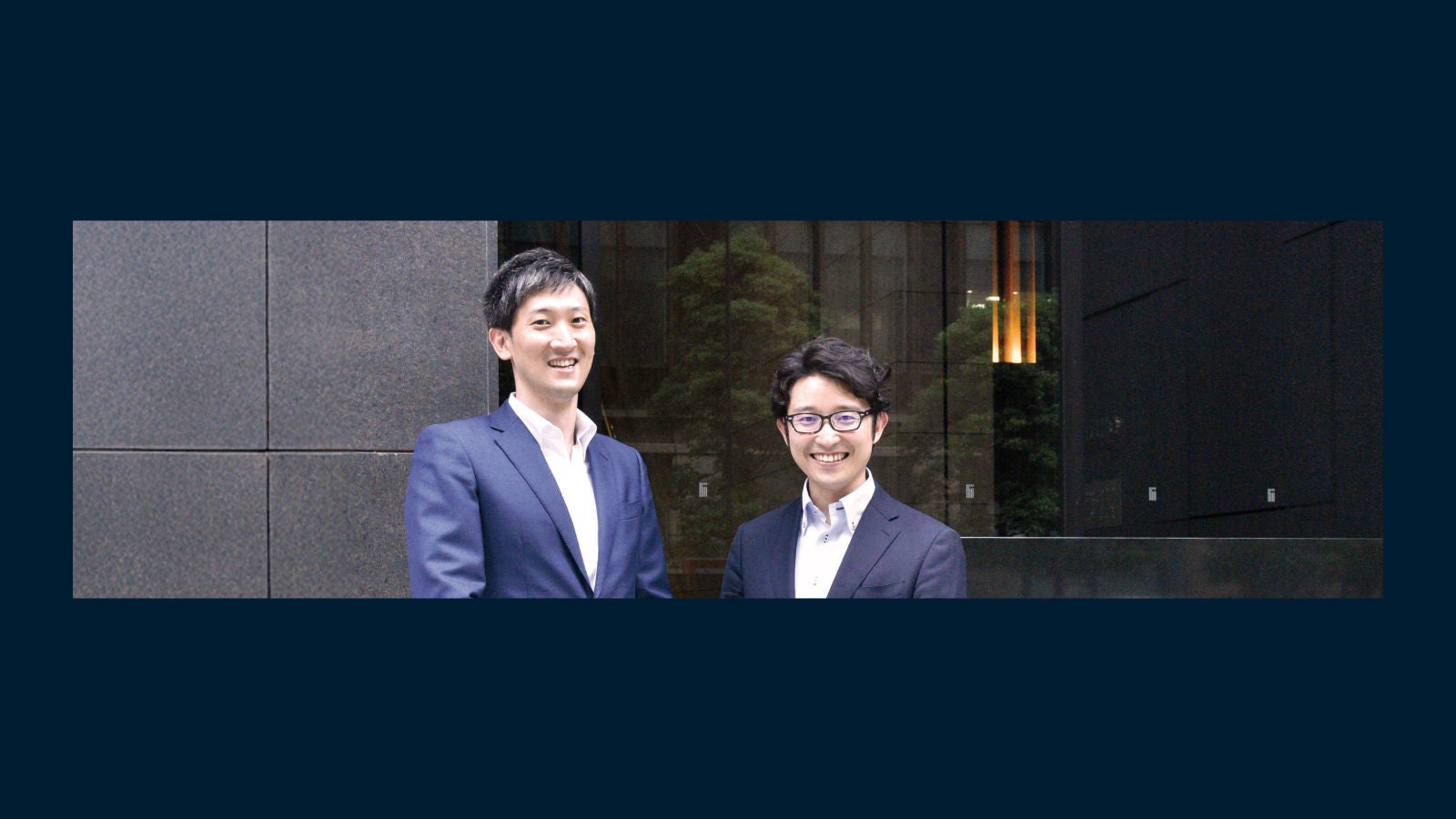 Mizuho Bank employees in front of one of their buildings
