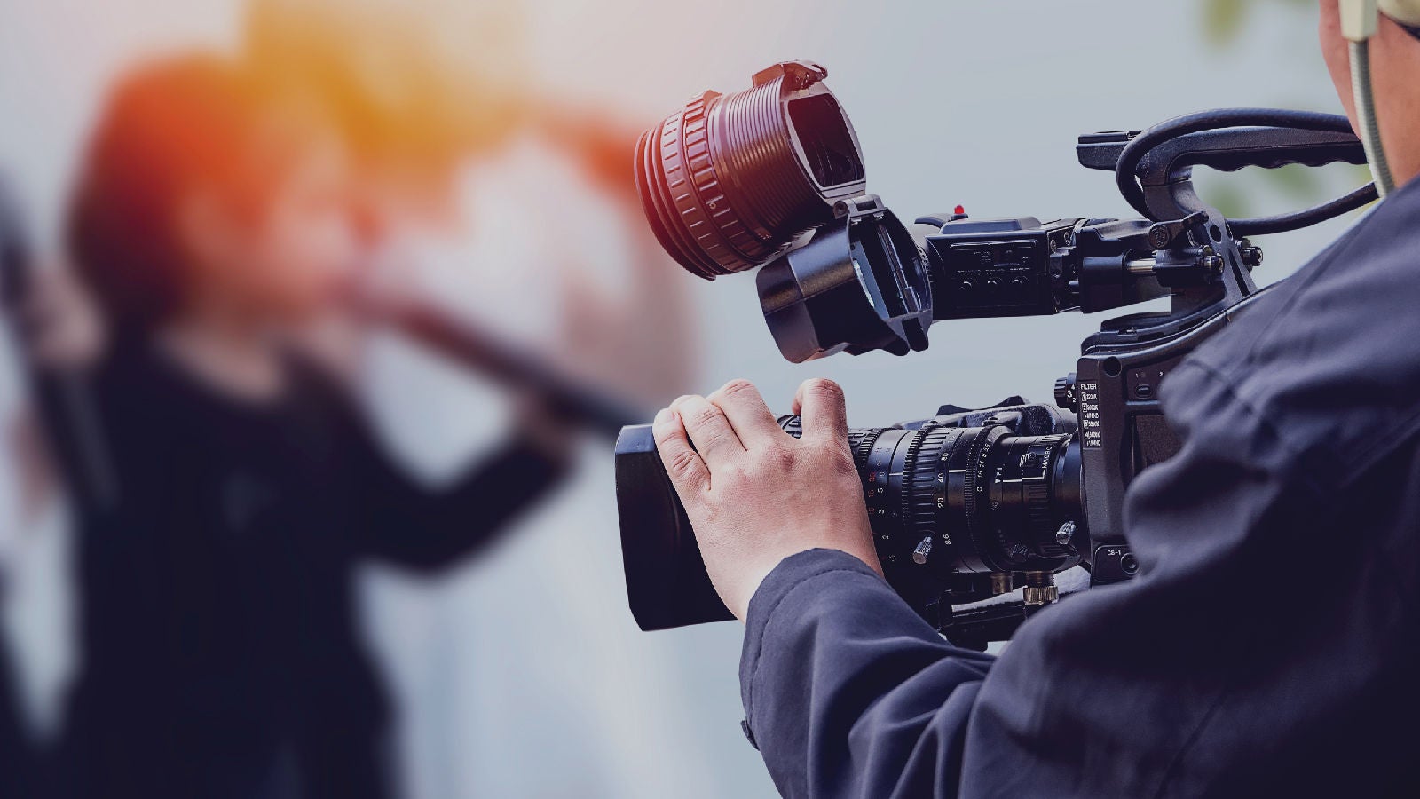 Person holding video camera