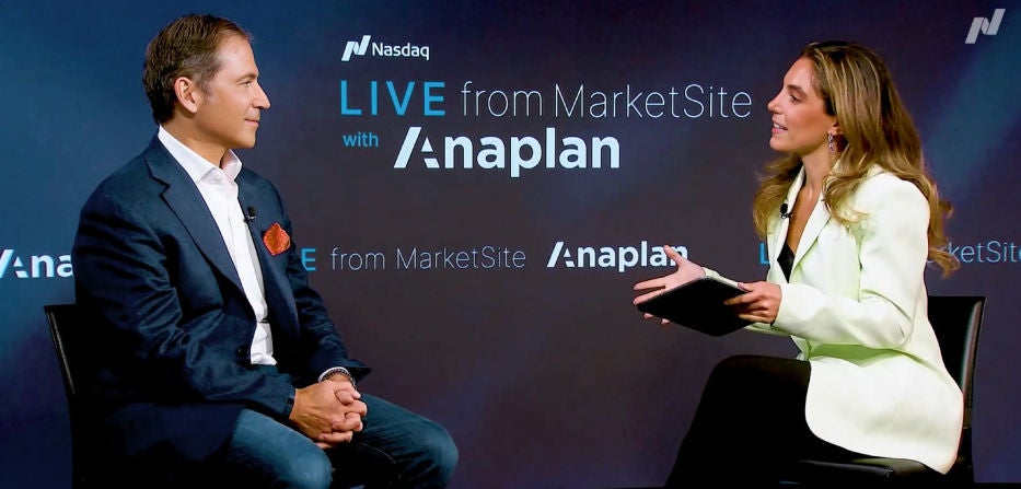 Anaplan CEO Charlie Gottdiener in conversation with a host during a 'LIVE from MarketSite with Anaplan' session, with Nasdaq and Anaplan logos on the background wall.