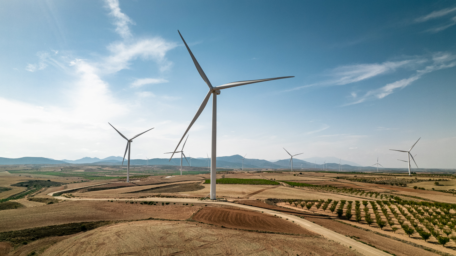 A windmill surrounded by sand