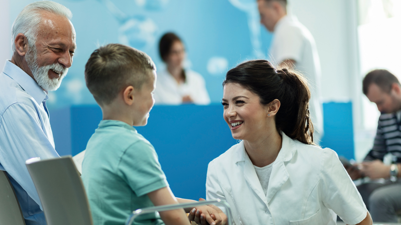 Woman smiling at a young boy