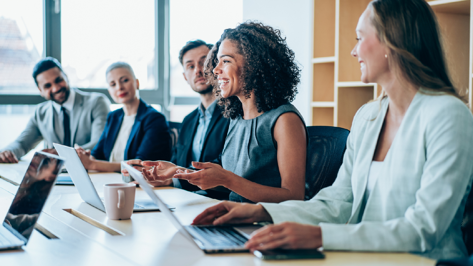 Group of people sitting around a conference table