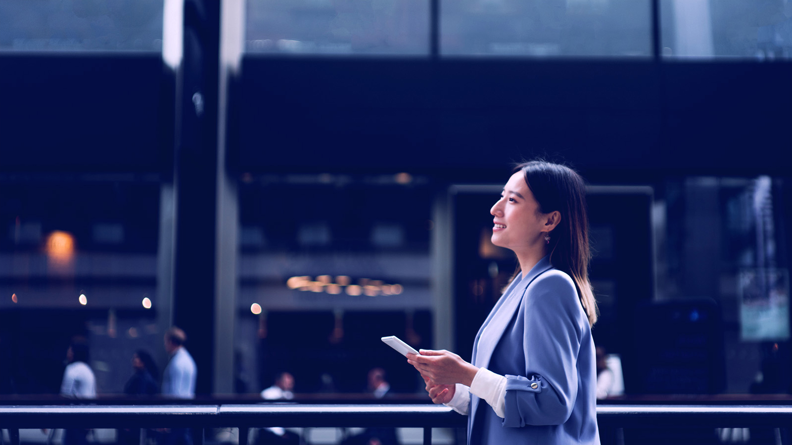 Businesswoman looking pensive staring off into the distance, side portfolio shot