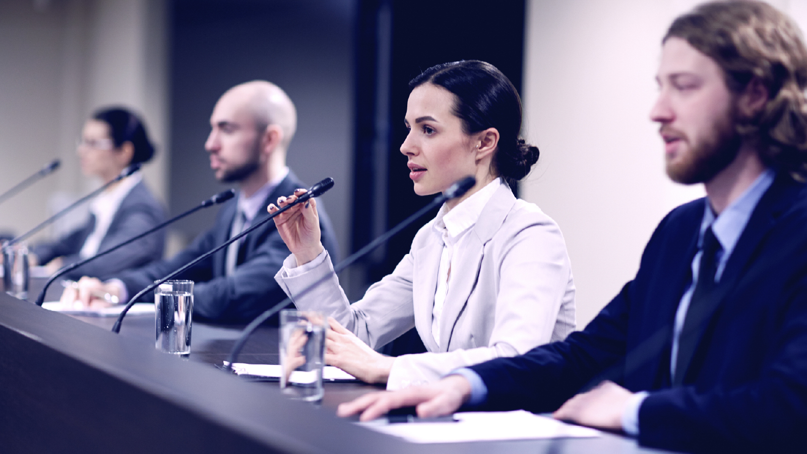 Panel of people sitting at a table