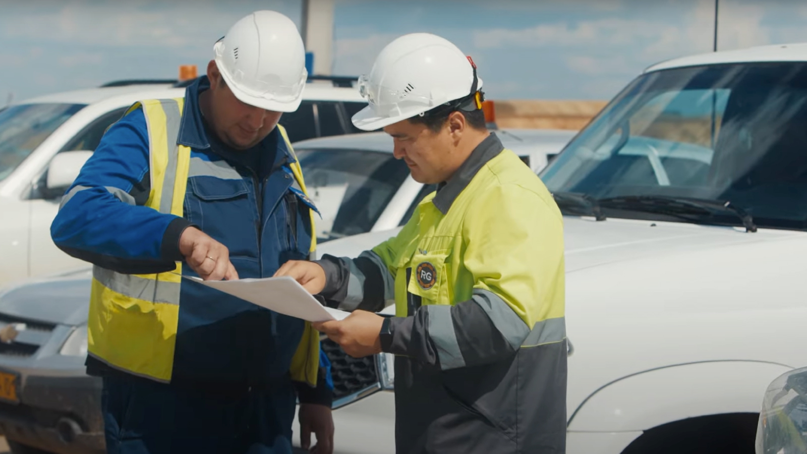 Two Workers Discussing the Plan