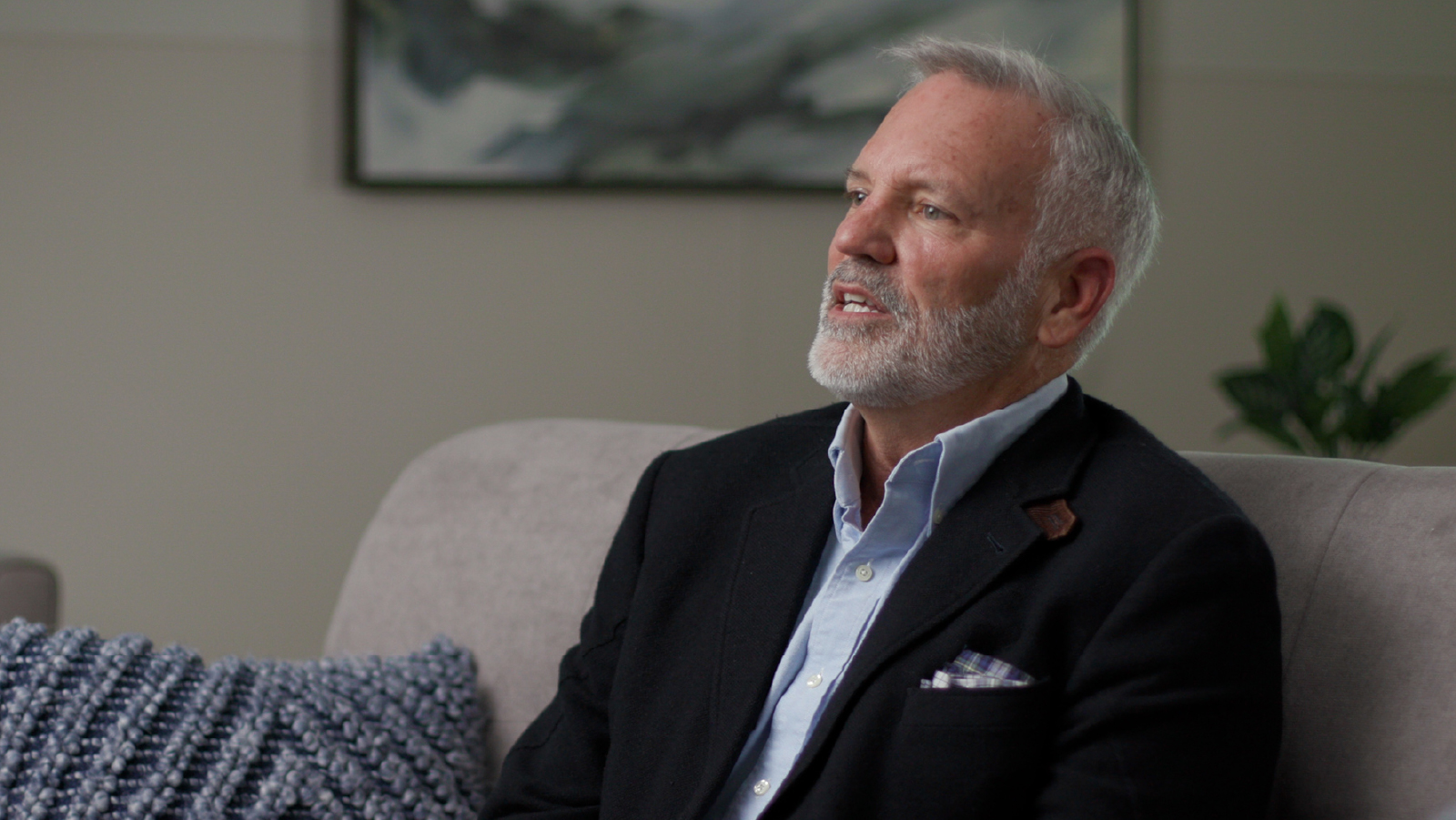 Business man in interview against neutral background